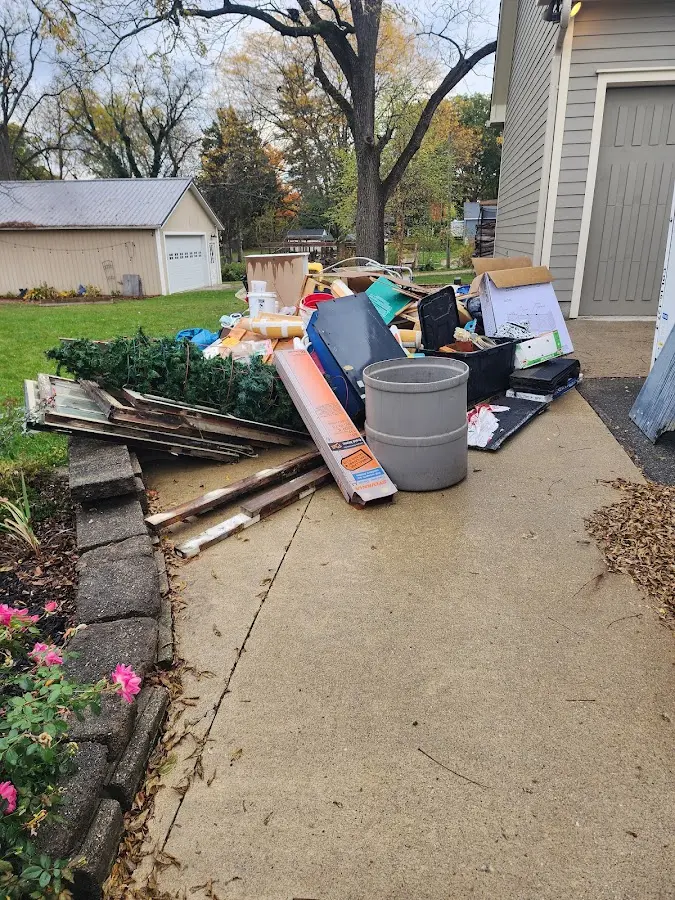 Dumpster being loaded with debris for 30 Yard Dumpster Rental in Sandwich